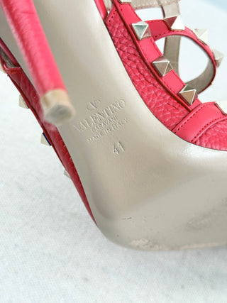 Valentino Rockstud pumps crafted in grained calfskin leather featuring pointed toe, adjustable slingback straps, and platinum-finish signature rockstud embellishments, 41