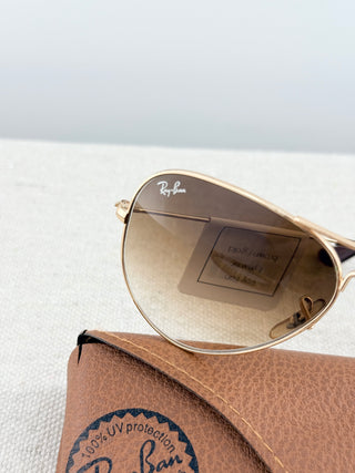 Ray Ban Aviator sunglasses featuring lightweight frame, and classic teardrop-shaped lenses