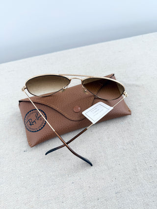 Ray Ban Aviator sunglasses featuring lightweight frame, and classic teardrop-shaped lenses