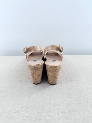 Stuart Weitzman patent leather wedge sandals featuring peep-toe, adjustable slingback straps, and cork-covered platform wedge, 5