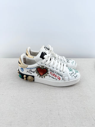 Dolce and Gabbana portofino sneakers crafted in leather with graffiti-inspired design, handwritten motifs, finished with decorative embellishments at heel, 39.5