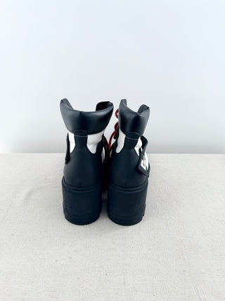 Moncler Blanche ankle boots crafted in grained leather with chunky lug soles, block heel, and logo-detailed ankle strap, 39.5