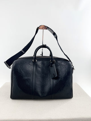 Gucci leather GG embossed jumbo duffle bag with strap