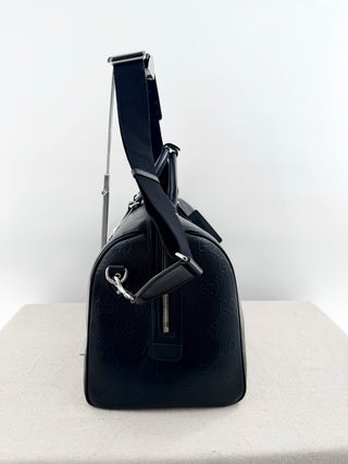 Gucci leather GG embossed jumbo duffle bag with strap