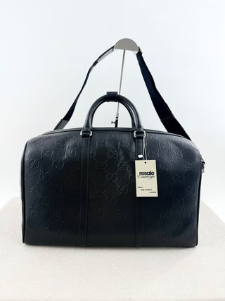 Gucci leather GG embossed jumbo duffle bag with strap