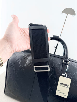Gucci leather GG embossed jumbo duffle bag with strap