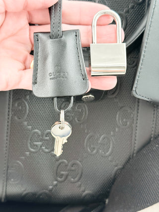 Gucci leather GG embossed jumbo duffle bag with strap