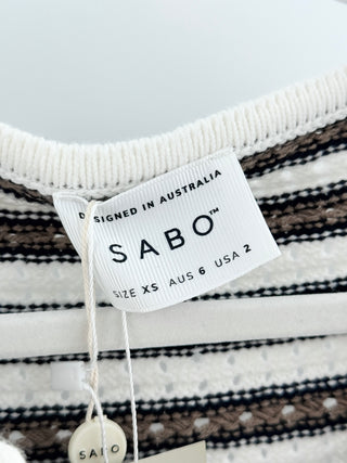 Sabo Kaeli knit mini dress designed with rounded neckline, full-length sleeves, and button-front closure with fabric-covered buttons crafted from textured cotton-blend knit, XS