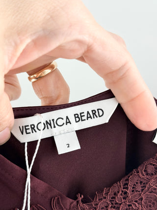 Veronica Beard bias cut midi dress crafted from satin with delicate eyelash lace trim, finished with asymmetrical hem and cascading lace trim, 2