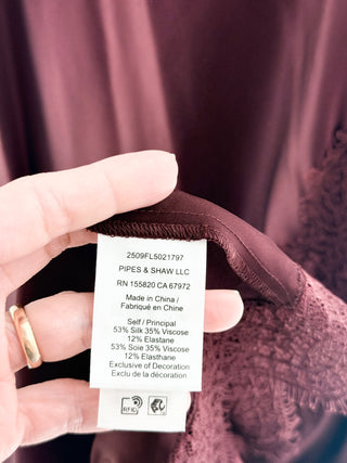 Veronica Beard bias cut midi dress crafted from satin with delicate eyelash lace trim, finished with asymmetrical hem and cascading lace trim, 2