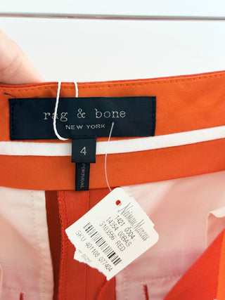 Rag and Bone tailored cropped trousers crafted in lightweight linen-blend fabric, features mid-rise waist, tapered leg, front slash pockets with button-tab accents, 4