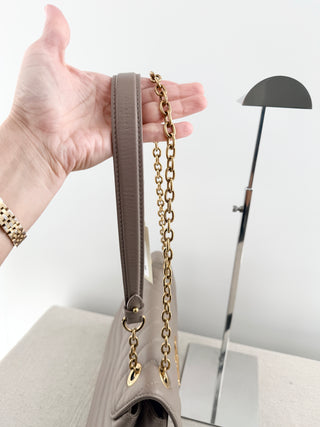 Louis Vuitton quilted leather bag with XL clasp and chain strap