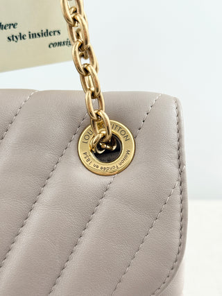 Louis Vuitton quilted leather bag with XL clasp and chain strap