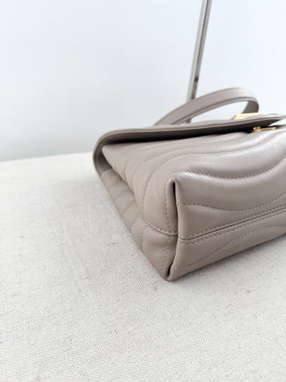 Louis Vuitton quilted leather bag with XL clasp and chain strap