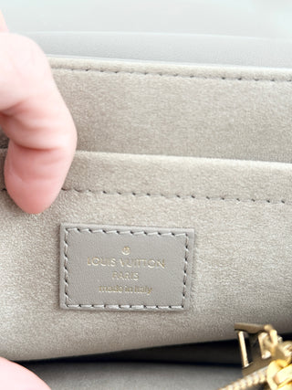 Louis Vuitton quilted leather bag with XL clasp and chain strap