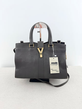YSL cabas chyc leather tote featuring iconic gold-tone Y hardware, dual rolled top handles, expandable side gussets