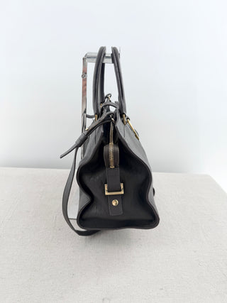 YSL cabas chyc leather tote featuring iconic gold-tone Y hardware, dual rolled top handles, expandable side gussets