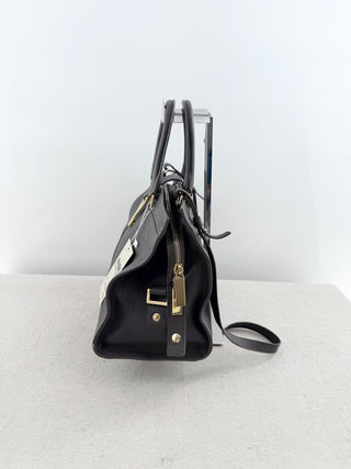 YSL cabas chyc leather tote featuring iconic gold-tone Y hardware, dual rolled top handles, expandable side gussets