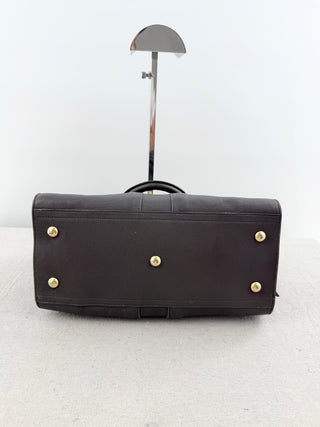YSL cabas chyc leather tote featuring iconic gold-tone Y hardware, dual rolled top handles, expandable side gussets