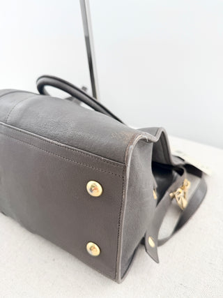 YSL cabas chyc leather tote featuring iconic gold-tone Y hardware, dual rolled top handles, expandable side gussets