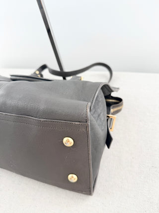 YSL cabas chyc leather tote featuring iconic gold-tone Y hardware, dual rolled top handles, expandable side gussets