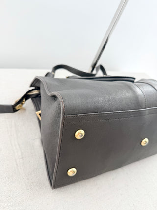 YSL cabas chyc leather tote featuring iconic gold-tone Y hardware, dual rolled top handles, expandable side gussets