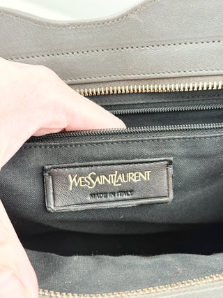 YSL cabas chyc leather tote featuring iconic gold-tone Y hardware, dual rolled top handles, expandable side gussets