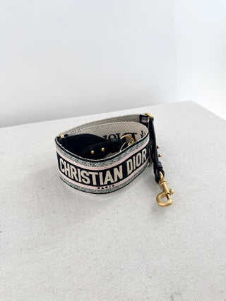 Christian Dior logo embroidered adjustable shoulder strap featuring iconic "Christian Dior Paris" logo woven throughout