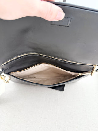 Tory Burch large flap reva clutch bag with embossed logo and short chain