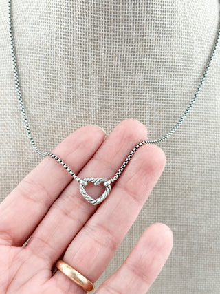 David Yurman sterling silver cable heart necklace featuring an open heart pendant accented with pave-set diamonds along the front and suspended from a delicate sterling silver box chain
