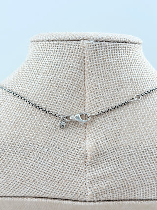 David Yurman sterling silver cable heart necklace featuring an open heart pendant accented with pave-set diamonds along the front and suspended from a delicate sterling silver box chain