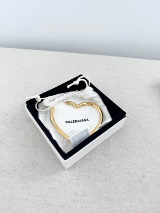 Balenciaga oversized heart-shaped hoop earring crafted in gold-tone metal
