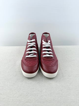 Gucci high top logo embossed leather sneakers, 39.5