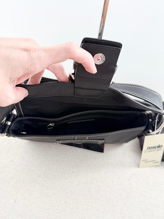 Coach leather shoulder bag with large buckle
