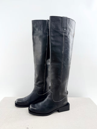 Ganni leather riding boots featuring knee-high distressed leather finish, subtle contrast stitching, and low stacked heel, 40