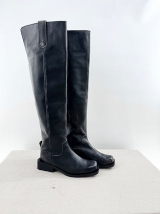 Ganni leather riding boots featuring knee-high distressed leather finish, subtle contrast stitching, and low stacked heel, 40