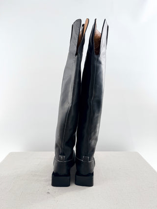 Ganni leather riding boots featuring knee-high distressed leather finish, subtle contrast stitching, and low stacked heel, 40
