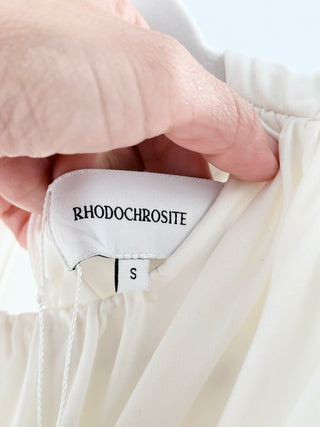 rhodochrosite ruched mini dress crafted from soft stretch fabric, features dramatic gathered detailing, structured cap sleeves, and high neckline, S