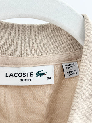 Lacoste polo top featuring Lacoste's allover geometric monogram jacquard pattern, 34