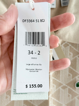 Lacoste polo top featuring Lacoste's allover geometric monogram jacquard pattern, 34
