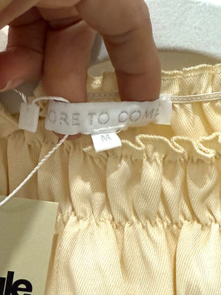 More to come Sets pale yellow, M