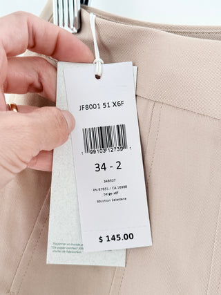Lacoste chic skirt features structured box pleats that create an A-line silhouette in smooth cotton fabric, 34