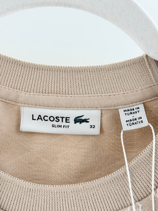Lacoste slim-fit short sleeve T-shirt featuring an allover geometric monogram jacquard pattern, contrast stripe detailing along shoulder, 32