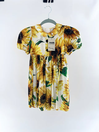 Dolce and Gabbana cotton dress featuring signature sunflower print, puff sleeves, peter pan collar, decorative button front, 6A