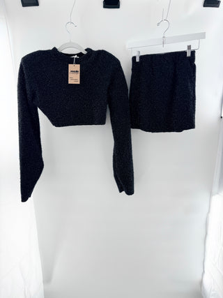 Nonchalant knit matching set featuring textured slightly shimmering boucle-style fabric. Includes cropped sweater paired with coordinating mini skirt, S