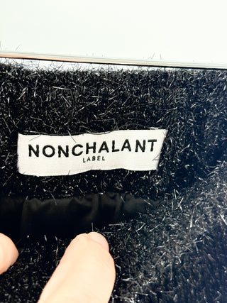 Nonchalant knit matching set featuring textured slightly shimmering boucle-style fabric. Includes cropped sweater paired with coordinating mini skirt, S