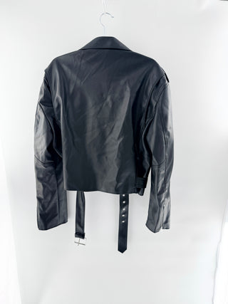 Storets faux leather cropped moto jacket featuring oversized, exaggerated lapels and asymmetrical zip closure, designed with hardware and statement belt, S/M