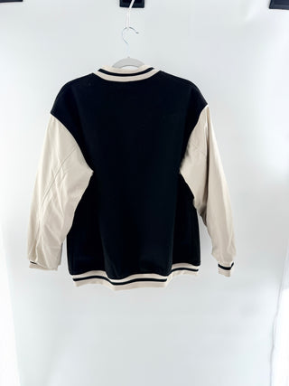 H&M varsity jacket featuring a wool-blend body with contrasting faux leather sleeves, designed with snap-button front, striped ribbed trim, S