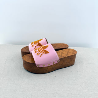 Gucci Gucci x Adidas clog slides featuring iconic trefoil logo set on GG monogram, 8.5
