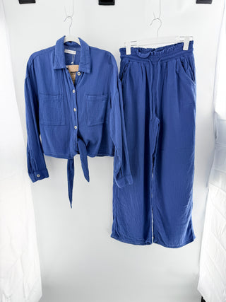 Mango two-piece set crafted from lightweight textured cotton featuring button-down long sleeve top with soft collar and tie-front detail paired with matching high-waisted pants, S